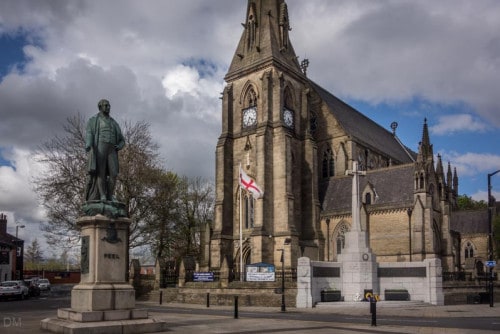 Bury Parish Church and statue of Sir Robert Peel.